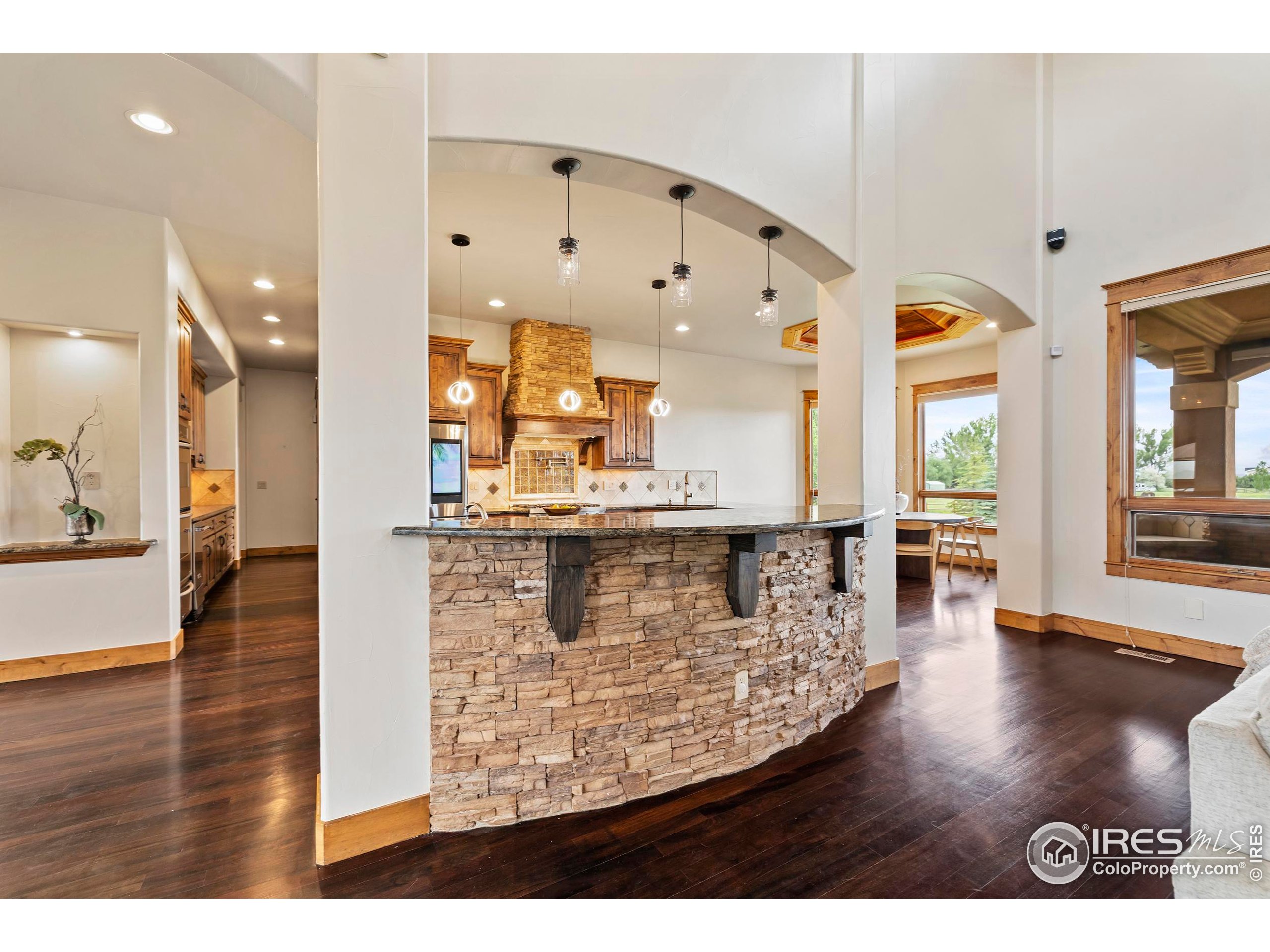863 Riparian Way Fort Collins, CO 80524 - Photo 10 of 38 a view of open kitchen with granite countertop a stove top oven