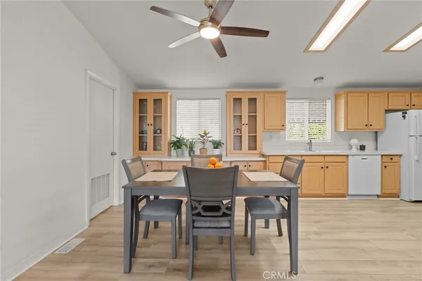 a view of a dining room with furniture and window