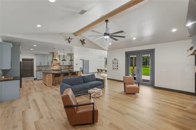 a kitchen with stainless steel appliances granite countertop a stove and a sink