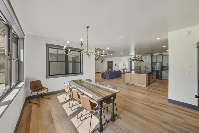 a spacious bathroom with a granite countertop sink and a mirror