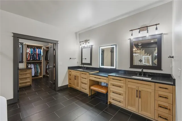 a bathroom with a sink a shower and a mirror