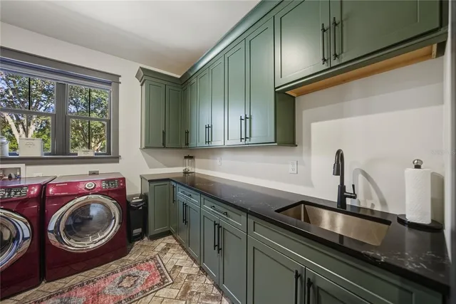 a view of a yard with plants and trees