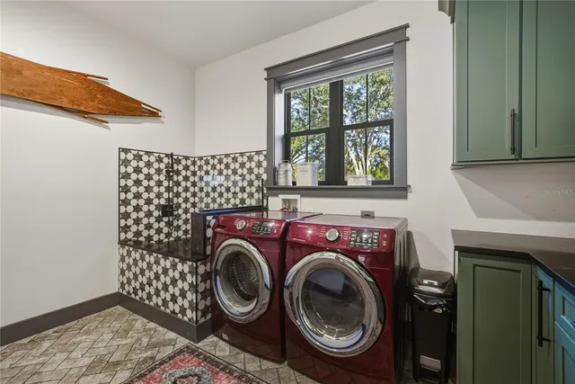 a view of a yard with wooden fence