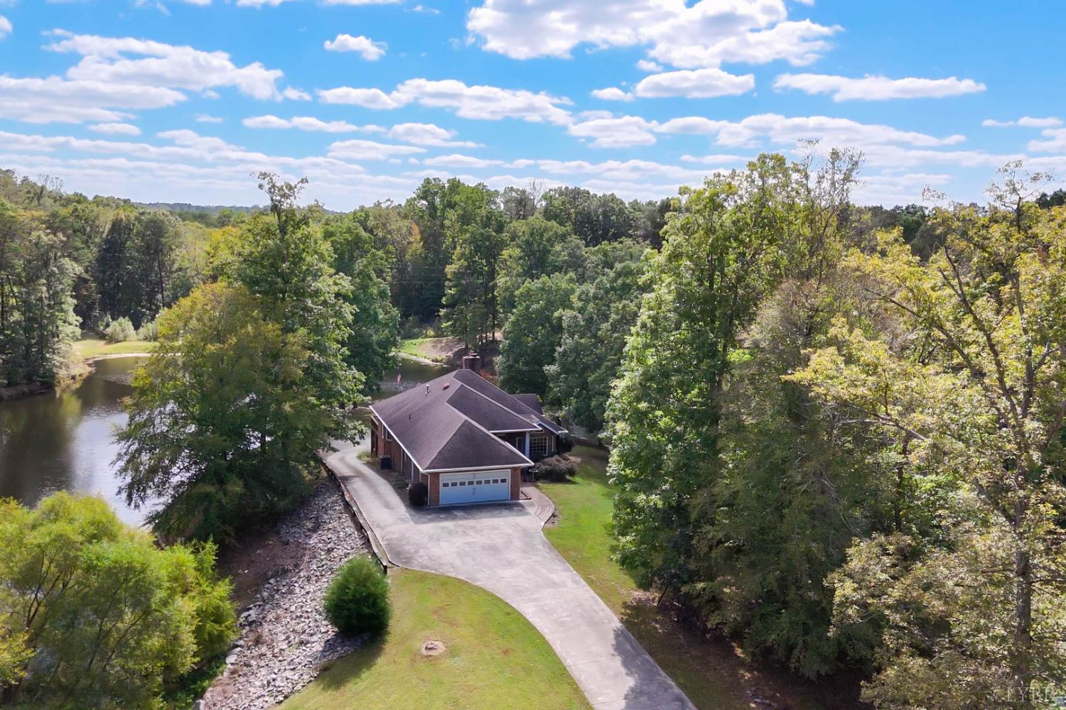 a view of a swimming pool with a yard