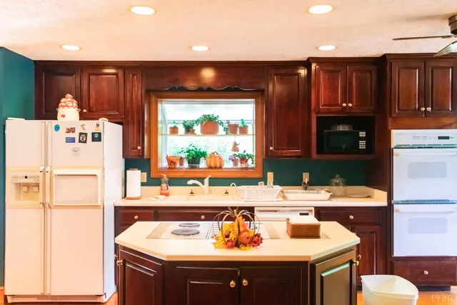 a kitchen with a sink appliances and cabinets