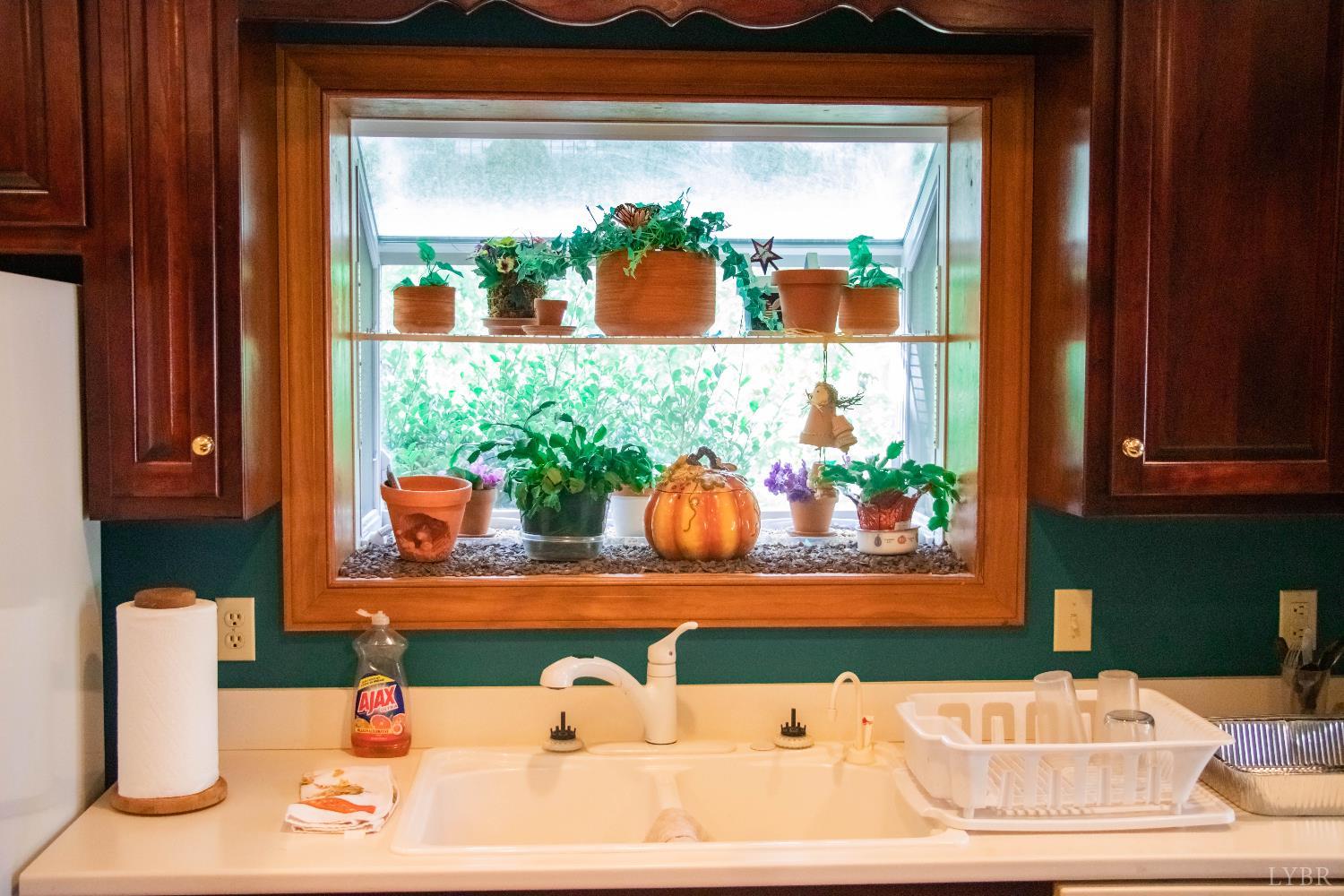 224 Walnut Road Danville, VA 24541 - Photo 15 of 54 a bathroom with a sink and a mirror