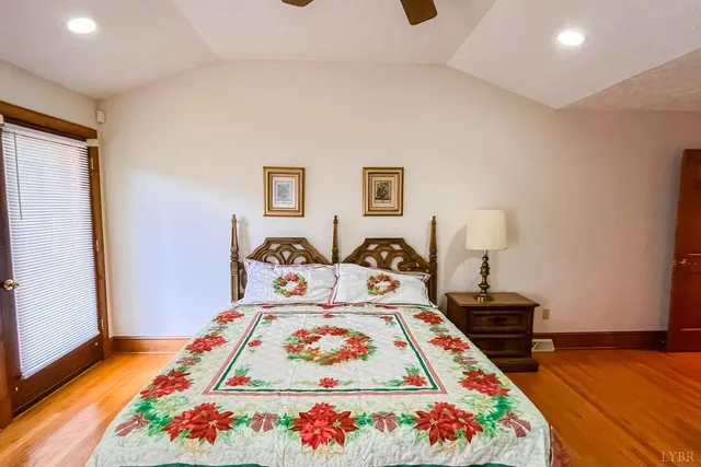 a bedroom with a bed and flat screen tv