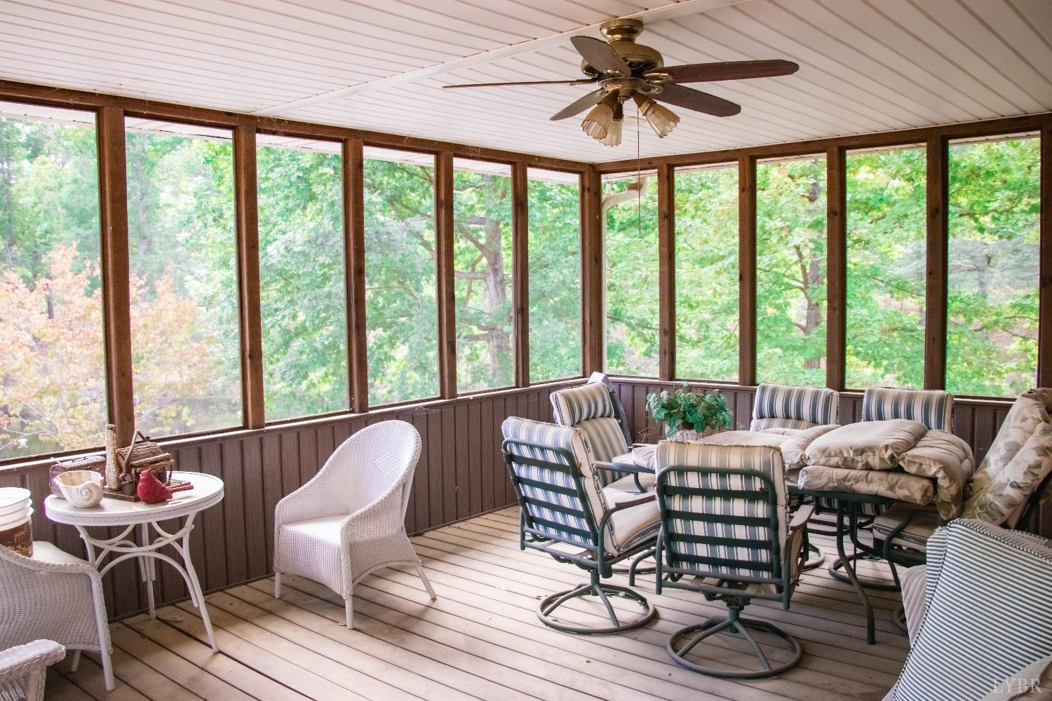 224 Walnut Road Danville, VA 24541 - Photo 28 of 54 a dining room with furniture large windows and wooden floor