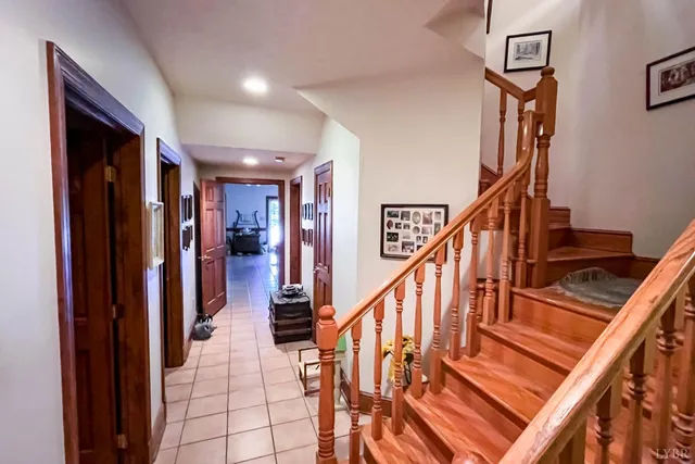 a living room with lots of furniture and a chandelier