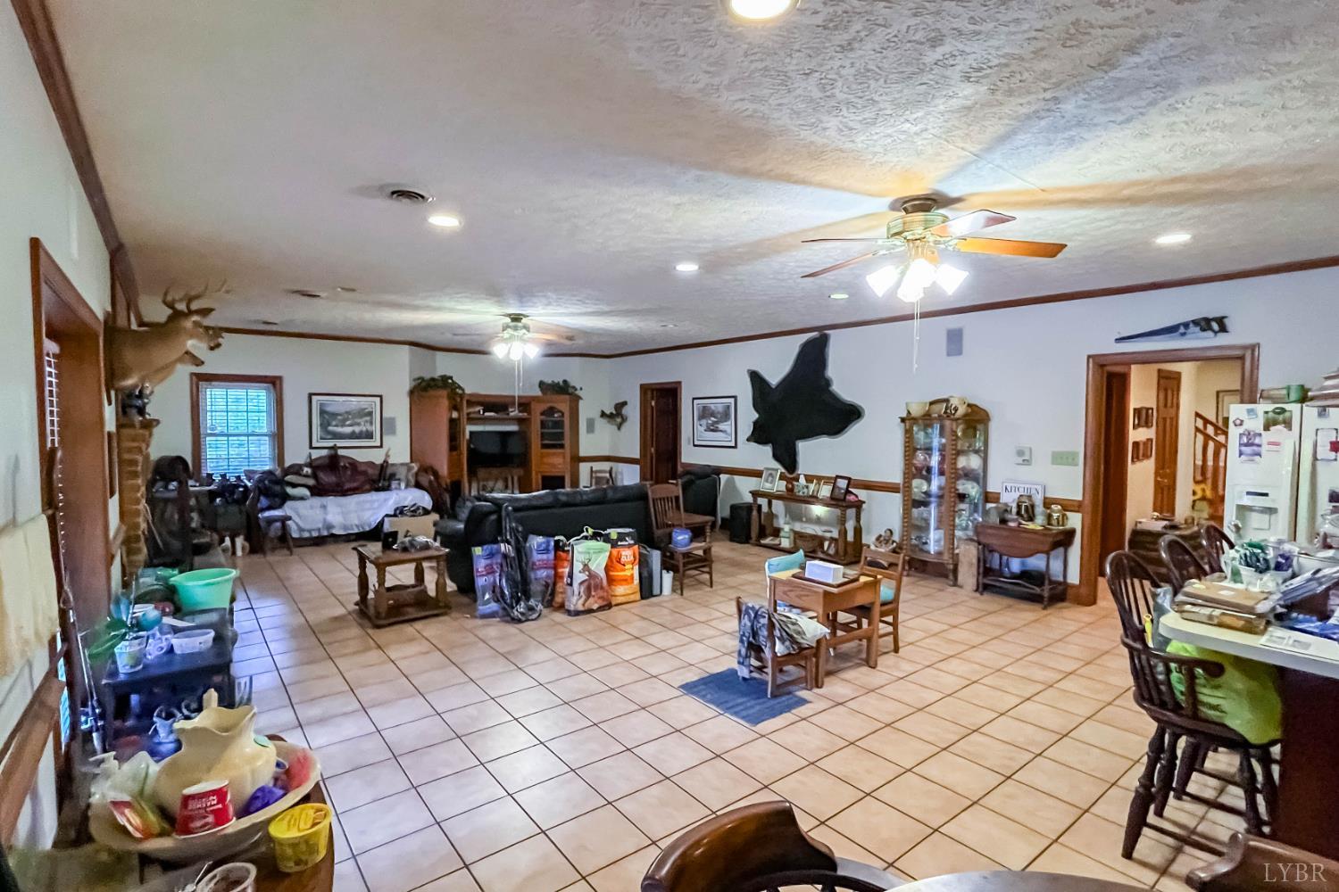 224 Walnut Road Danville, VA 24541 - Photo 34 of 54 a living room filled with furniture and a flat screen tv