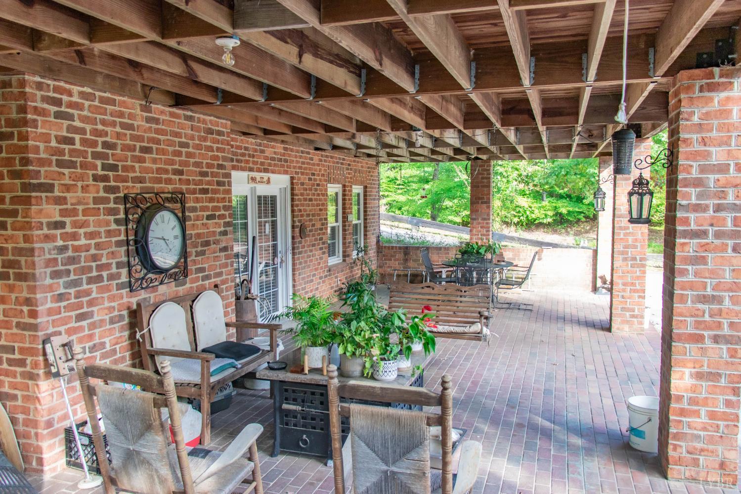 224 Walnut Road Danville, VA 24541 - Photo 41 of 54 a building outdoor space with patio furniture and potted plants