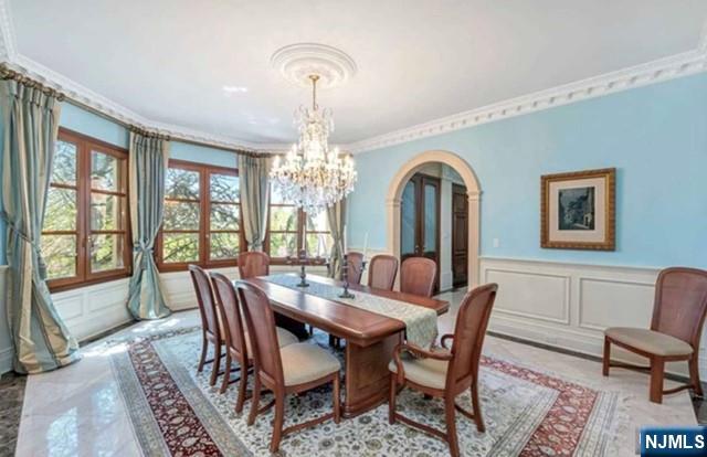 35 Timberline Drive Alpine, NJ 07620 - Photo 18 of 37 a view of a dining room with furniture a chandelier and wooden floor