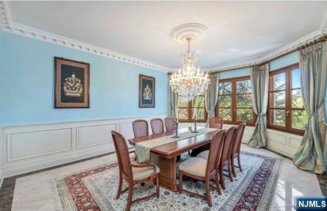 35 Timberline Drive Alpine, NJ 07620 - Photo 19 of 37 a view of a dining room with furniture a chandelier and wooden floor