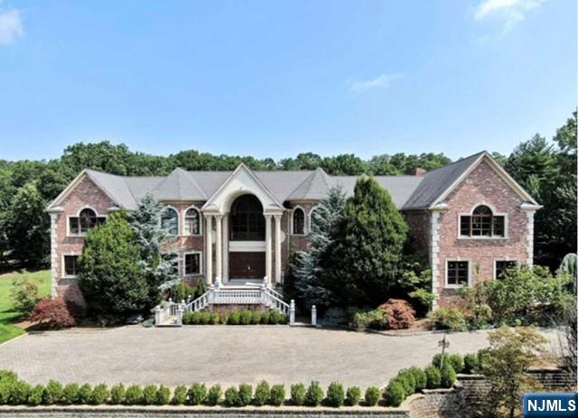 35 Timberline Drive Alpine, NJ 07620 - Photo 2 of 37 front view of a house with a yard