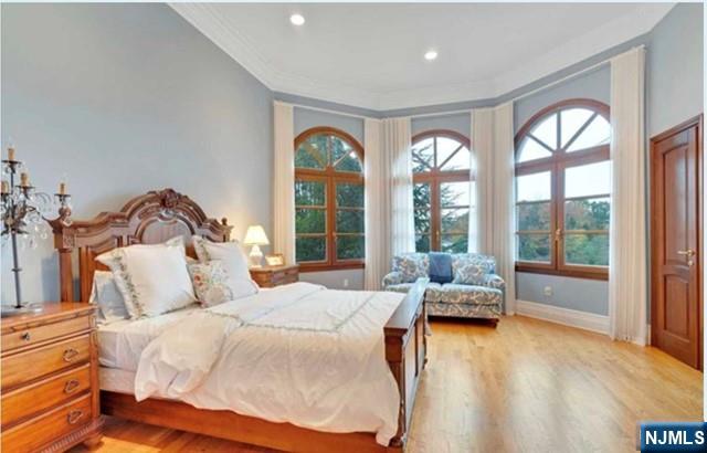 35 Timberline Drive Alpine, NJ 07620 - Photo 26 of 37 a bedroom with a bed and glass windows