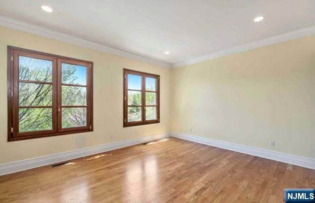 35 Timberline Drive Alpine, NJ 07620 - Photo 27 of 37 an empty room with wooden floor and windows