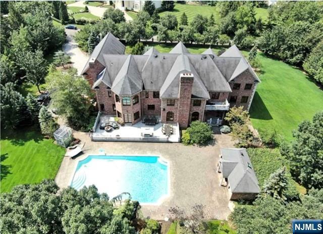 35 Timberline Drive Alpine, NJ 07620 - Photo 36 of 37 an aerial view of a house with swimming pool and garden