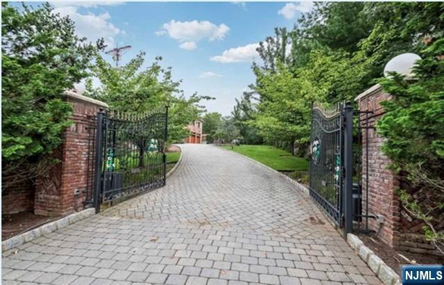 35 Timberline Drive Alpine, NJ 07620 - Photo 4 of 37 a view of a street with trees on both side of the road