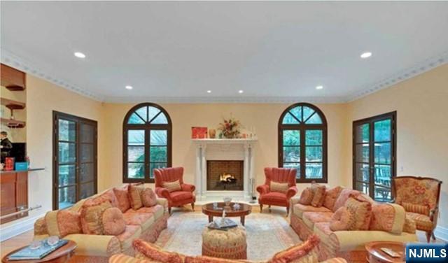 35 Timberline Drive Alpine, NJ 07620 - Photo 7 of 37 a living room with furniture fireplace and a large window