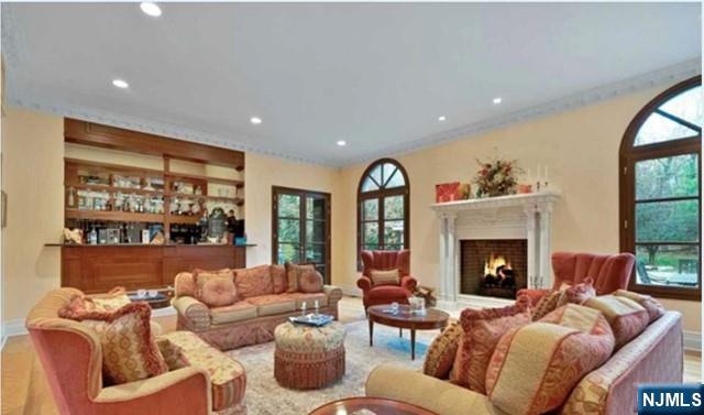 35 Timberline Drive Alpine, NJ 07620 - Photo 8 of 37 a living room with furniture and a fireplace