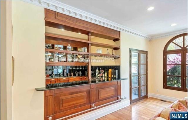 35 Timberline Drive Alpine, NJ 07620 - Photo 9 of 37 a living room with stainless steel appliances wooden floor and large window