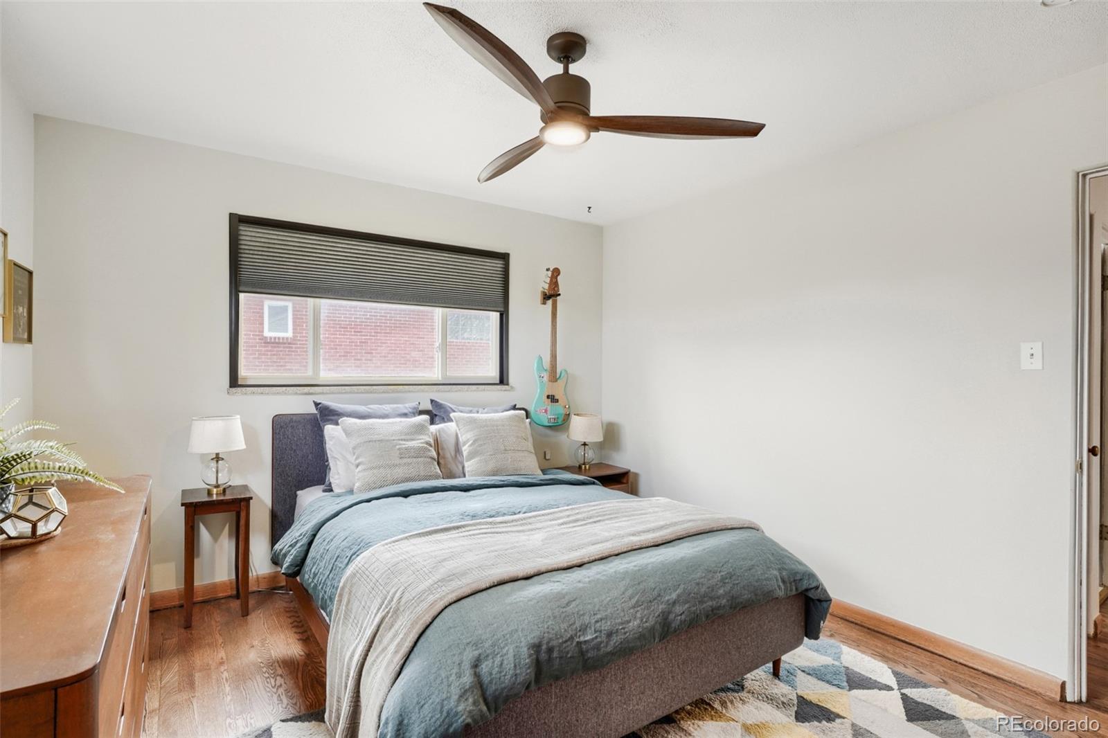 4560 Teller Street Wheat Ridge, CO 80033 - Photo 15 of 25 a bedroom with a bed and a window