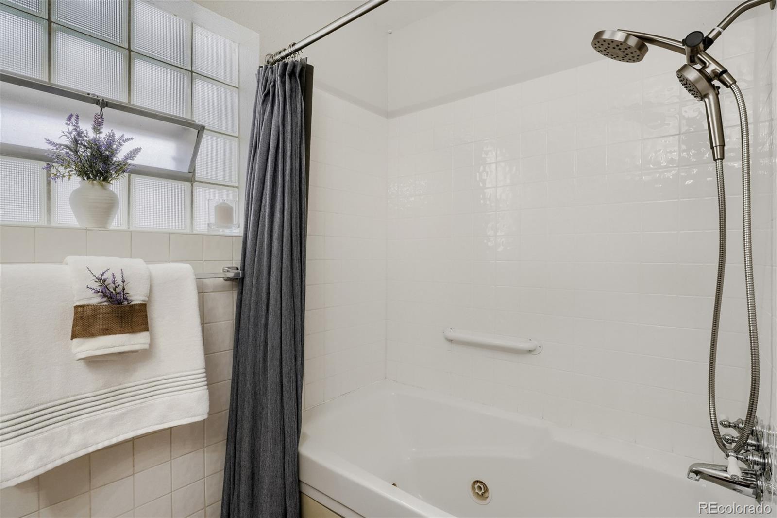 4560 Teller Street Wheat Ridge, CO 80033 - Photo 20 of 25 a bathroom with a bathtub and a shower