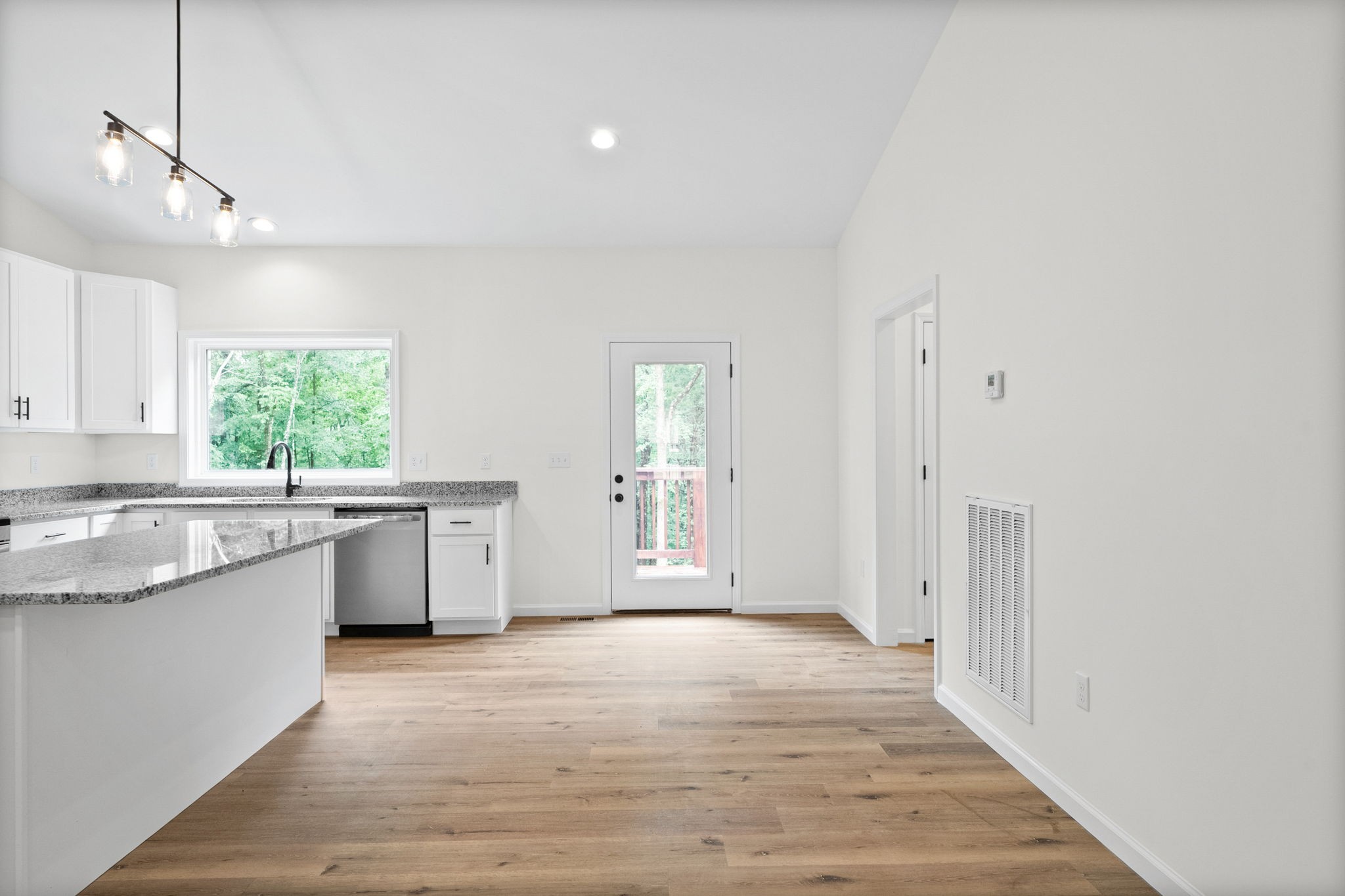 690 Brazzle Road Waverly, TN 37185 - Photo 11 of 35 a view of a kitchen with a sink cabinets and wooden floor