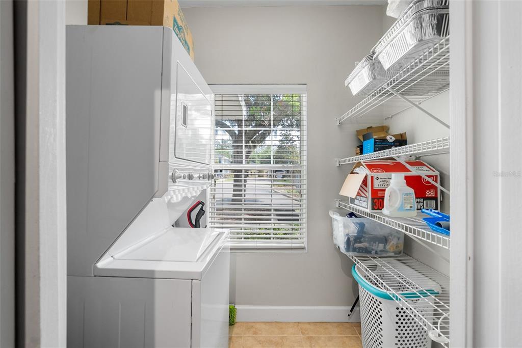 2927 Southwest 35th Place, Unit 113 Gainesville, FL 32608 - Photo 14 of 27 a utility room with a window dryer and washer