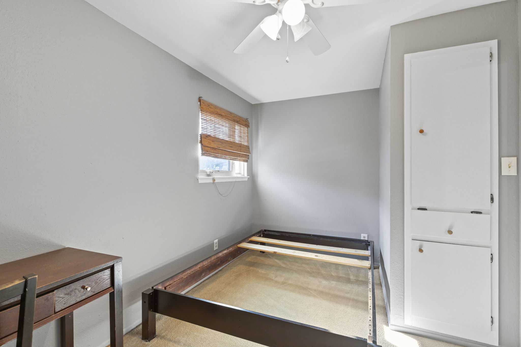 7808 Watson Street, Unit B Austin, TX 78757 - Photo 11 of 12 a room with chandelier fan and windows