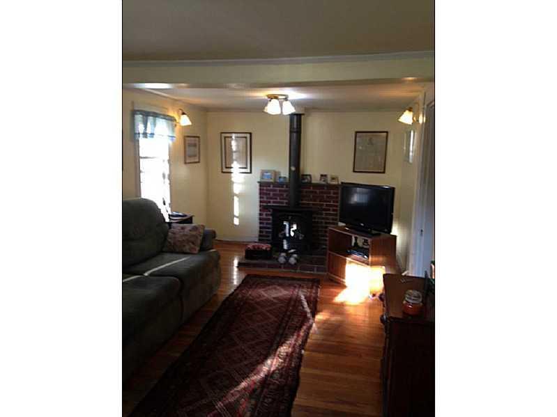 114 River Road Brunswick, ME 04011 - Photo 1 of 17 Living Room. Gas Stove in the Living...