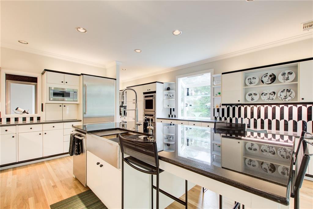 115 Cross Roads Court Atlanta, GA 30327 - Photo 13 of 55 a kitchen with granite countertop a stove a sink and a refrigerator