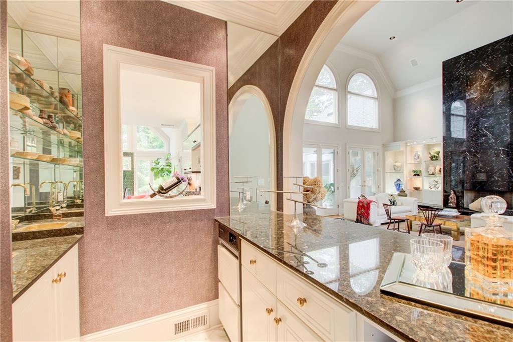 115 Cross Roads Court Atlanta, GA 30327 - Photo 16 of 55 a kitchen with sink and mirror with window