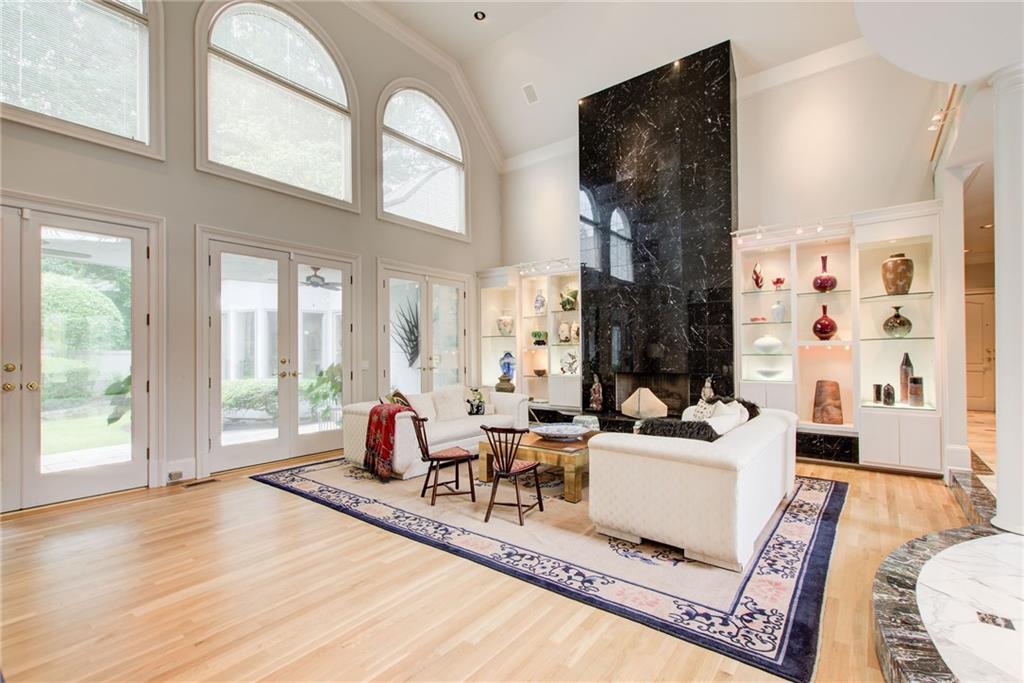 115 Cross Roads Court Atlanta, GA 30327 - Photo 19 of 55 a living room with fireplace furniture and a large window