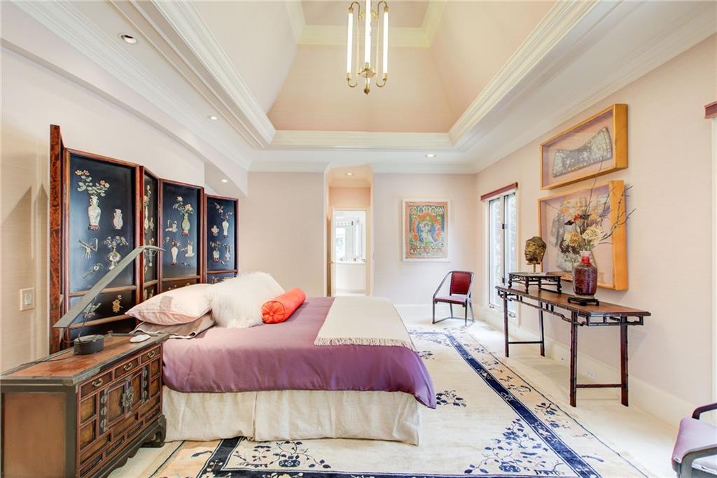 115 Cross Roads Court Atlanta, GA 30327 - Photo 22 of 55 a bedroom with a bed and wooden floor