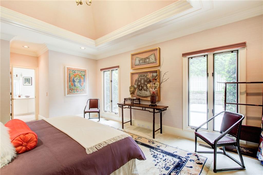 115 Cross Roads Court Atlanta, GA 30327 - Photo 23 of 55 a bedroom with a bed and large windows