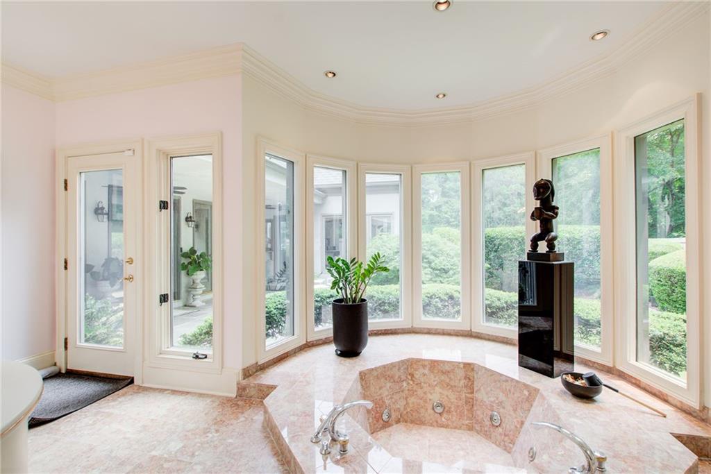 115 Cross Roads Court Atlanta, GA 30327 - Photo 27 of 55 a living room with furniture and large windows