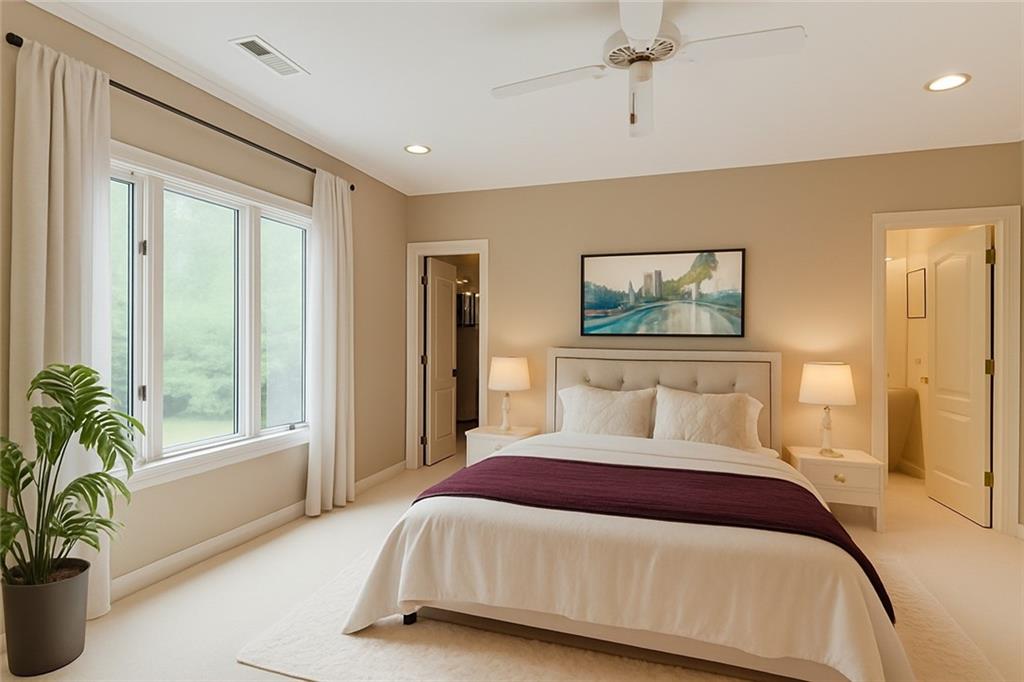115 Cross Roads Court Atlanta, GA 30327 - Photo 32 of 55 a bedroom with a large bed and a large window