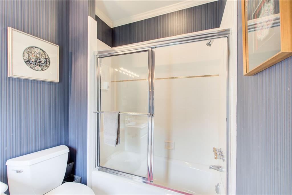 115 Cross Roads Court Atlanta, GA 30327 - Photo 34 of 55 a white toilet sitting next to a bathroom