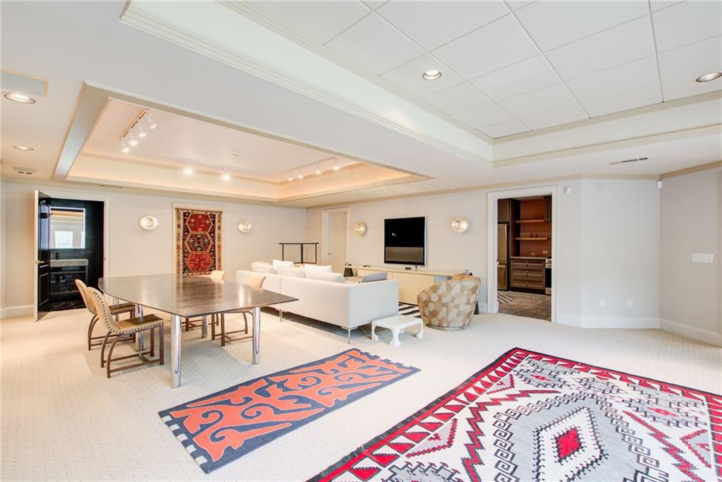 115 Cross Roads Court Atlanta, GA 30327 - Photo 42 of 55 a living room with furniture and a wooden floor