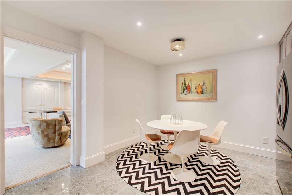 115 Cross Roads Court Atlanta, GA 30327 - Photo 46 of 55 a bedroom with a bed and wooden floor