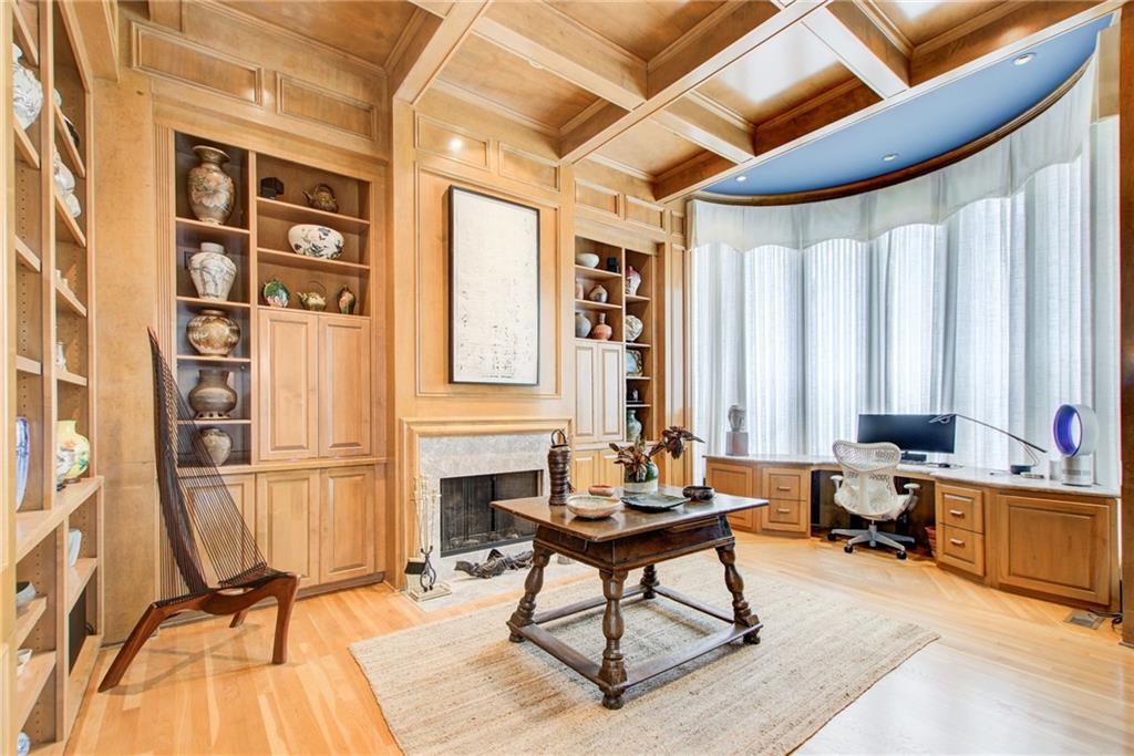 115 Cross Roads Court Atlanta, GA 30327 - Photo 5 of 55 a living room with furniture a fireplace and large windows