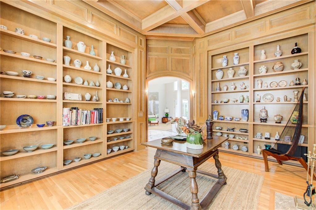 115 Cross Roads Court Atlanta, GA 30327 - Photo 6 of 55 a living room with furniture and a book shelf