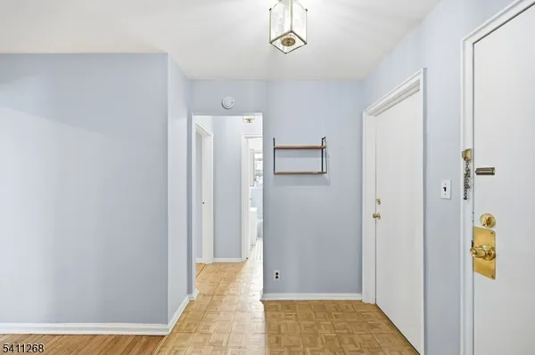a view of a hallway with a room