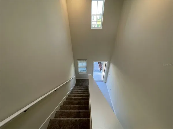 a view of a hallway with windows
