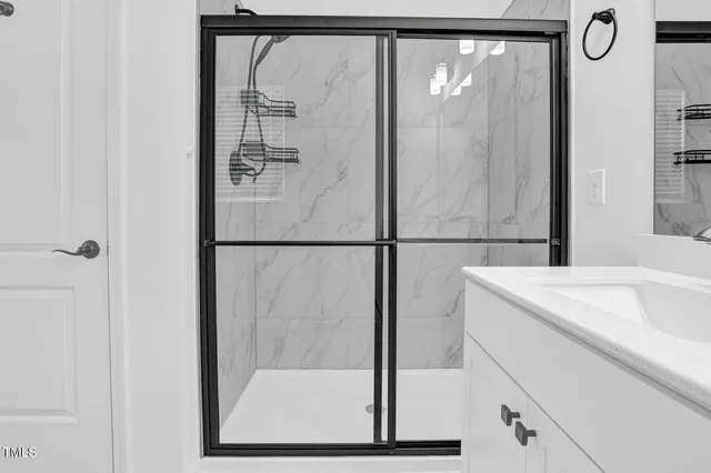 a bathroom with a sink and mirror