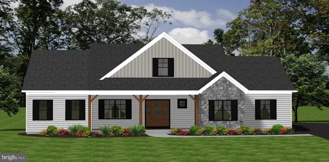 a front view of a house with a yard and green space