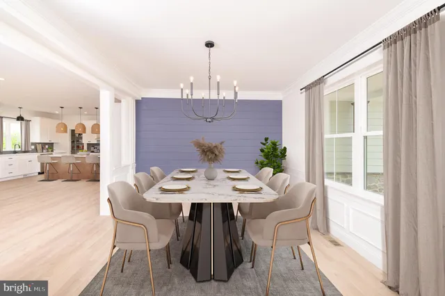 a view of a dining room with furniture and window