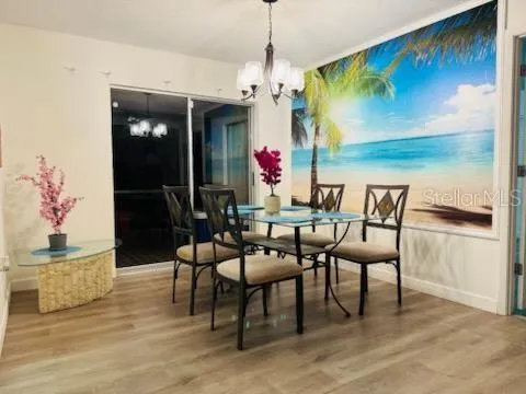 a dining room with furniture and window