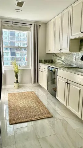 a view of backyard with white floor and chair